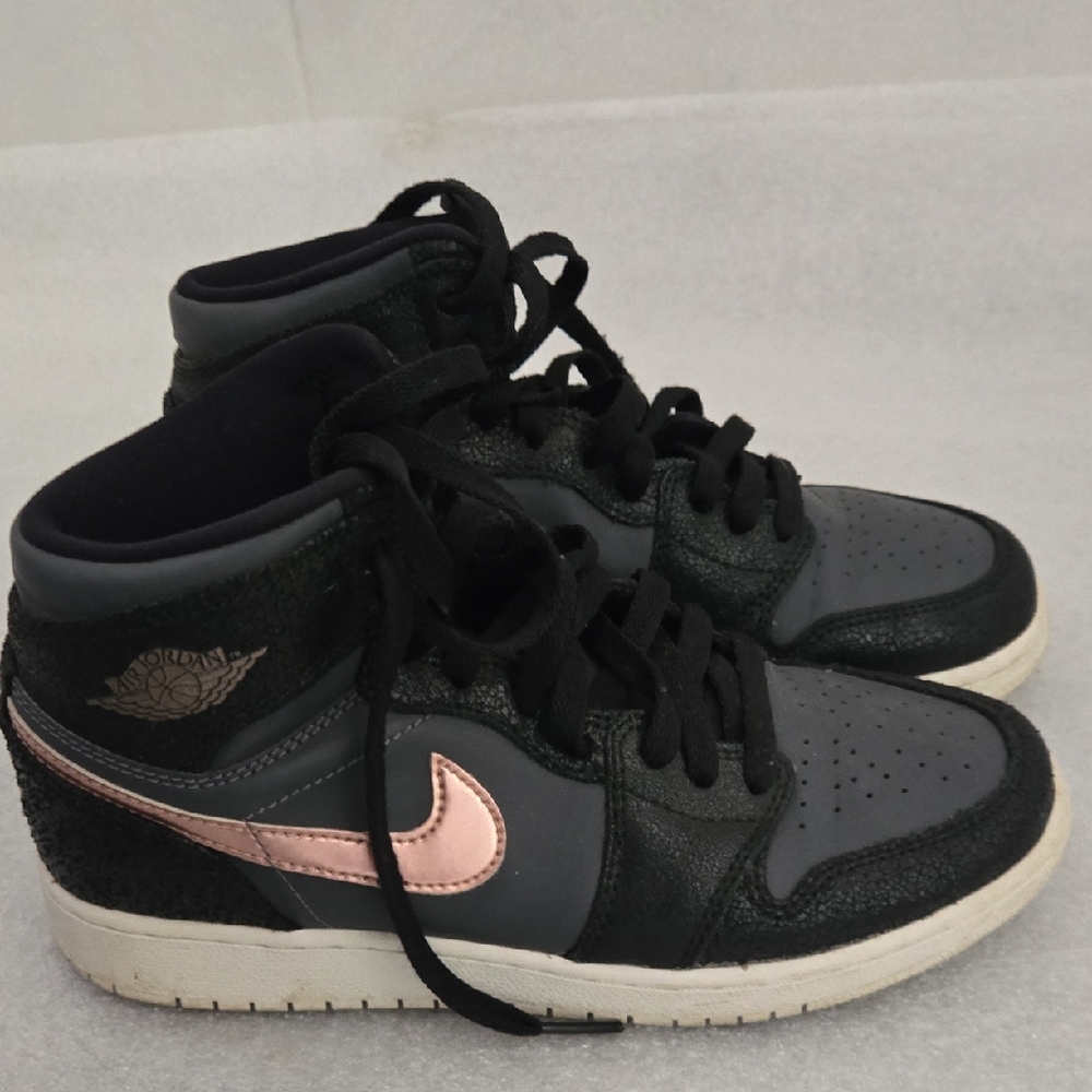 Nike Air Jordans Black and Pink High-Top Sneakers